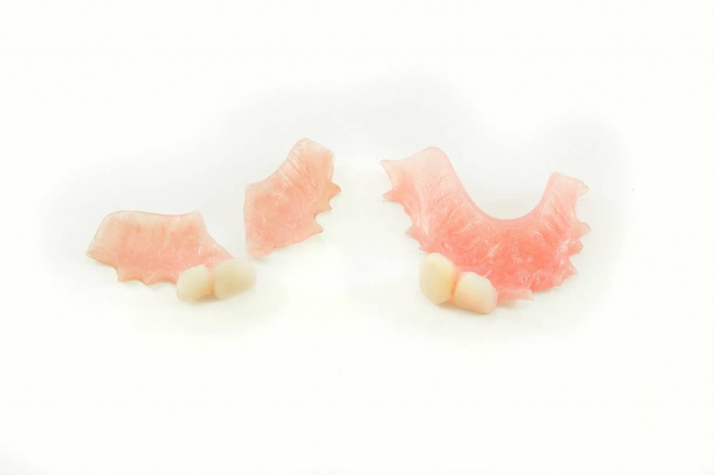 Broken denture with fixed denture