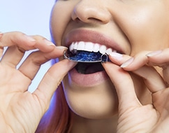Woman putting in a retainer